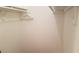 A bright, empty closet featuring white walls and built-in shelving, perfect for storage and organization at 4302 Aqua Vista Dr # G, Orlando, FL 32839