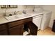 A clean kitchen area with a white sink, dishwasher, counter, and washing machine at 4302 Aqua Vista Dr # G, Orlando, FL 32839