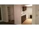 Kitchenette area with updated appliances, washer/dryer, and ample cabinet space at 4302 Aqua Vista Dr # G, Orlando, FL 32839