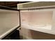 Interior of a clean, white microwave oven with a rotating glass plate at 4302 Aqua Vista Dr # G, Orlando, FL 32839