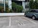 Exterior view showing parking spot 11G, landscaping, and the facade of the home at 4302 Aqua Vista Dr # G, Orlando, FL 32839