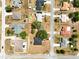 Aerial view of a neighborhood showing roof styles, driveways, and street layout at 4680 Sw 142 Place Rd, Ocala, FL 34473