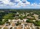 Aerial view of a residential area showcasing homes, streets, and lush greenery at 4680 Sw 142 Place Rd, Ocala, FL 34473