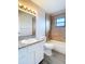 Modern bathroom boasts new vanity, granite countertop, and tiled shower at 4680 Sw 142 Place Rd, Ocala, FL 34473
