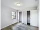 Bedroom features two closets, vinyl floors and a window at 4680 Sw 142 Place Rd, Ocala, FL 34473