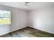Bedroom with a window and wood-look vinyl flooring at 4680 Sw 142 Place Rd, Ocala, FL 34473