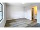 Bedroom featuring vinyl flooring and ensuite bathroom with granite counters at 4680 Sw 142 Place Rd, Ocala, FL 34473