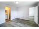 Bedroom featuring vinyl flooring and ensuite bathroom with updated vanity at 4680 Sw 142 Place Rd, Ocala, FL 34473