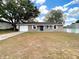 Charming single-story home with a gray exterior and a well-maintained front yard at 4680 Sw 142 Place Rd, Ocala, FL 34473