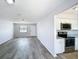 Open living space with views to the kitchen, featuring modern appliances and fixtures at 4680 Sw 142 Place Rd, Ocala, FL 34473