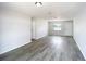 Bright living room showcasing modern flooring and lots of natural light at 4680 Sw 142 Place Rd, Ocala, FL 34473