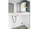 Utility room with water heater and shelving, ready for laundry appliances at 4680 Sw 142 Place Rd, Ocala, FL 34473