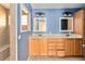 Bathroom featuring double sink vanity with cabinet storage and neutral wall paint at 5155 Holopaw Rd, St Cloud, FL 34773