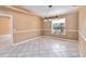 Classic dining room featuring wainscoting and bright natural light at 5155 Holopaw Rd, St Cloud, FL 34773