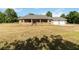 Charming single-story brick home with an attached two-car garage and a well-manicured lawn at 5155 Holopaw Rd, St Cloud, FL 34773