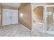 Foyer with tile flooring and double front doors, creating a welcoming entrance with neutral wall color at 5155 Holopaw Rd, St Cloud, FL 34773