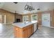 Spacious kitchen with island sink and fireplace in the open layout at 5155 Holopaw Rd, St Cloud, FL 34773