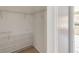 Bright walk-in closet featuring wire shelving, ready for organizing clothes and accessories at 5155 Holopaw Rd, St Cloud, FL 34773