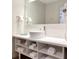 Contemporary bathroom boasts a stylish vessel sink, ample storage, and a hair dryer at 5245 W Irlo Bronson Memorial Hwy # 113, Kissimmee, FL 34746