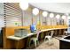 Business center features sleek workstations, computer access, and overhead lighting at 5245 W Irlo Bronson Memorial Hwy # 113, Kissimmee, FL 34746