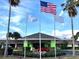 Greenpoint Kissimmee entrance featuring an American flag and clear skies in the background at 5245 W Irlo Bronson Memorial Hwy # 113, Kissimmee, FL 34746