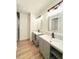 Updated bathroom with dual vanities, modern fixtures, and a walk-in shower at 5704 Sw 108Th St, Ocala, FL 34476