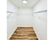 Walk-in closet with new wood floors, shelving and light; ready for your personal touch! at 5704 Sw 108Th St, Ocala, FL 34476
