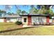 Well-manicured front yard and inviting entrance to this charming home at 5704 Sw 108Th St, Ocala, FL 34476