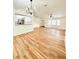 Open living area with new floors, modern lighting, and seamless flow to the kitchen at 5704 Sw 108Th St, Ocala, FL 34476