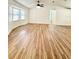 Bright and airy living room with new flooring and vaulted ceiling for a modern, spacious feel at 5704 Sw 108Th St, Ocala, FL 34476