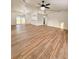 Open-concept living area with updated flooring and modern fixtures providing a welcoming atmosphere at 5704 Sw 108Th St, Ocala, FL 34476