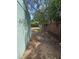 Side yard of property with wooden privacy fence at 6124 Fox Hunt Trl, Orlando, FL 32808
