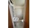 Bright bathroom features a pedestal sink, and a walk-in shower with tiled walls at 6124 Fox Hunt Trl, Orlando, FL 32808