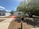 Inviting single-story home with a vibrant red driveway and lush front yard at 6124 Fox Hunt Trl, Orlando, FL 32808
