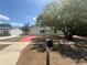Inviting single-story home with a vibrant red driveway and lush front yard at 6124 Fox Hunt Trl, Orlando, FL 32808