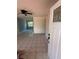 Inviting living room featuring tile flooring with a ceiling fan and large windows at 6124 Fox Hunt Trl, Orlando, FL 32808