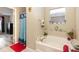 Bathroom with a tub, and a window at 709 Crystal Bay Ln, Orlando, FL 32828