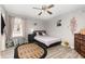 Charming bedroom featuring wood-look floors and decorated walls at 709 Crystal Bay Ln, Orlando, FL 32828