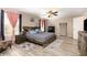 Spacious bedroom with decorative rugs, and wood-look floors at 709 Crystal Bay Ln, Orlando, FL 32828