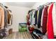 Walk-in closet featuring wood-look floors and ample storage space at 709 Crystal Bay Ln, Orlando, FL 32828
