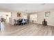 Bright dining room with modern flooring, neutral walls, and a decorative dining table at 709 Crystal Bay Ln, Orlando, FL 32828