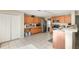 Bright kitchen featuring oak cabinetry, white countertops, and stainless-steel appliances at 709 Crystal Bay Ln, Orlando, FL 32828