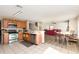 Spacious kitchen with stainless appliances open to dining and living areas for seamless entertaining at 709 Crystal Bay Ln, Orlando, FL 32828