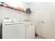 Functional laundry room equipped with a modern washer and dryer, offering convenience at 709 Crystal Bay Ln, Orlando, FL 32828