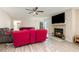 Open living room featuring modern flooring, fireplace, and comfortable seating, perfect for relaxation at 709 Crystal Bay Ln, Orlando, FL 32828