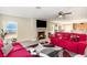 Inviting living room with fireplace, modern flooring, and cozy seating, ideal for gatherings at 709 Crystal Bay Ln, Orlando, FL 32828