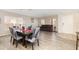 Cozy living space featuring neutral walls, modern flooring, and a dining area, inviting comfort at 709 Crystal Bay Ln, Orlando, FL 32828