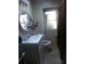 Modest bathroom featuring neutral tones, vanity with sink, and standard toilet at 7406 Nolton Way, Orlando, FL 32822