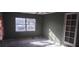 Cozy bedroom with a large window, perfect for relaxation at 7406 Nolton Way, Orlando, FL 32822