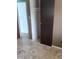 Bedroom closet space featuring neutral walls and tiled flooring at 7406 Nolton Way, Orlando, FL 32822